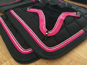 Two Anna Scarpati saddle pads and fly veil